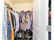 Organized walk-in closet with shelving and hanging space, perfect for storing clothing and accessories at 9595 Sw 51St Cir, Ocala, FL 34476