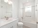 Bright bathroom featuring modern vanity, spacious tub, and clear glass shower doors at 9871 Sw 105Th Ct, Ocala, FL 34481