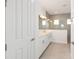 Stylish bathroom featuring double vanity, modern fixtures, a glass-enclosed shower, and tiled floors at 9871 Sw 105Th Ct, Ocala, FL 34481