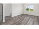 Bright dining space with hardwood floors and a view to the property exterior at 9871 Sw 105Th Ct, Ocala, FL 34481
