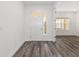 Spacious entry with wood-look flooring and a view into the adjacent living area at 9871 Sw 105Th Ct, Ocala, FL 34481