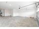 Large two car garage, water heater on the left, concrete floor and high ceilings at 9871 Sw 105Th Ct, Ocala, FL 34481
