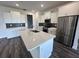 Modern kitchen with white cabinetry, stainless steel appliances, and a large island at 9871 Sw 105Th Ct, Ocala, FL 34481