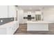 Modern kitchen featuring a large island with stainless steel appliances and white cabinets at 9871 Sw 105Th Ct, Ocala, FL 34481