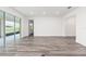 Bright, open living space with hardwood floors, patio access and recessed lighting at 9871 Sw 105Th Ct, Ocala, FL 34481