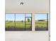A covered patio with an amazing view of the green grass and neighborhood homes at 9871 Sw 105Th Ct, Ocala, FL 34481