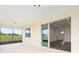 The covered patio features a view of the backyard and an entrance into the home at 9871 Sw 105Th Ct, Ocala, FL 34481