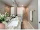 Bathroom featuring a granite vanity, tile floors, and a tiled walk-in shower with a curtain at 9983 Sw 188Th Cir, Dunnellon, FL 34432