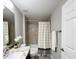 Bathroom featuring a shower-tub, decorative accents, and a neutral color scheme at 9983 Sw 188Th Cir, Dunnellon, FL 34432