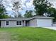 Charming one-story home with a well-maintained lawn and attached two-car garage at 9983 Sw 188Th Cir, Dunnellon, FL 34432