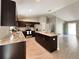 Well-lit kitchen features granite countertops, stainless appliances and a center island, perfect for cooking and entertaining at 9983 Sw 188Th Cir, Dunnellon, FL 34432