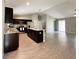 Modern kitchen featuring a large center island, stainless appliances, and an open floor plan at 9983 Sw 188Th Cir, Dunnellon, FL 34432
