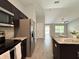 Modern kitchen with stainless steel appliances, granite countertops, and an island that provides ample workspace at 9983 Sw 188Th Cir, Dunnellon, FL 34432