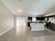 Open floor plan featuring dining area and view of the modern kitchen with stainless appliances at 9983 Sw 188Th Cir, Dunnellon, FL 34432
