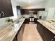 Kitchen featuring granite countertops, stainless steel appliances and dark wood cabinetry at 9983 Sw 188Th Cir, Dunnellon, FL 34432
