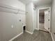 Convenient laundry room featuring tile flooring, utility connections, and access to the garage at 9983 Sw 188Th Cir, Dunnellon, FL 34432