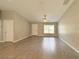Bright living room features tile floors, natural light and neutral paint, offering a welcoming space to relax and entertain at 9983 Sw 188Th Cir, Dunnellon, FL 34432