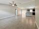 Open floor plan features tile floors, neutral paint and abundant natural light from the sliding doors and windows at 9983 Sw 188Th Cir, Dunnellon, FL 34432