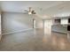 Open living room features tile floors, neutral paint and lots of natural light at 9983 Sw 188Th Cir, Dunnellon, FL 34432