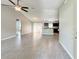 Spacious living room featuring tile floors with open view into the kitchen and dining area at 9983 Sw 188Th Cir, Dunnellon, FL 34432