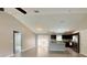 Bright living room showcases tile flooring, and flows into an open kitchen with stainless steel appliances at 9983 Sw 188Th Cir, Dunnellon, FL 34432