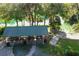 Scenic aerial view of a park with a pavilion and a river with people swimming at 9983 Sw 188Th Cir, Dunnellon, FL 34432
