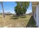 Spacious backyard showcasing mature trees and plenty of open space for outdoor activities at 10081 Se 68Th Ct, Belleview, FL 34420