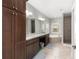 Spacious bathroom with dual sinks, large vanity, soaking tub, and walk-in shower at 10081 Se 68Th Ct, Belleview, FL 34420