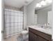Bathroom featuring a shower-tub combination and modern vanity with granite countertops at 10081 Se 68Th Ct, Belleview, FL 34420