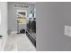 Functional laundry room featuring a washer, dryer, and window with natural light at 10081 Se 68Th Ct, Belleview, FL 34420