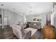 Inviting living room with comfortable furnishings and dark wood-look flooring at 10081 Se 68Th Ct, Belleview, FL 34420