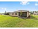 Lush backyard featuring a well-maintained lawn and a screened-in lanai at 10556 Sw 96Th Lane Rd, Ocala, FL 34481