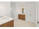 Bathroom featuring double sinks, wood cabinets, white countertops and a linen closet at 10556 Sw 96Th Lane Rd, Ocala, FL 34481