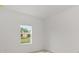 Bright bedroom featuring a window with neighborhood views at 10556 Sw 96Th Lane Rd, Ocala, FL 34481