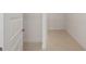 Spacious walk-in closet featuring light tile flooring and neutral walls at 10556 Sw 96Th Lane Rd, Ocala, FL 34481