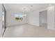 Dining room with sliding door to patio, chandelier, and large window for natural light at 10556 Sw 96Th Lane Rd, Ocala, FL 34481