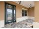 Beautiful front entrance featuring a decorative glass door, paver flooring, and neutral exterior paint at 10556 Sw 96Th Lane Rd, Ocala, FL 34481