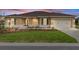 Charming single-story home with manicured lawn, paver driveway, and welcoming two-car garage at 10556 Sw 96Th Lane Rd, Ocala, FL 34481