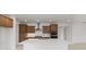 Modern kitchen with stainless steel appliances, ample cabinets, and a large island with a sink at 10556 Sw 96Th Lane Rd, Ocala, FL 34481