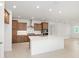 Modern kitchen with stainless steel appliances, ample cabinets, and a large island with a sink at 10556 Sw 96Th Lane Rd, Ocala, FL 34481