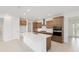 Modern kitchen with stainless steel appliances, ample cabinets, and a large island with a sink at 10556 Sw 96Th Lane Rd, Ocala, FL 34481