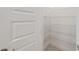 Bright pantry with an open door and organized with multiple levels of white wire shelving for ample storage at 10556 Sw 96Th Lane Rd, Ocala, FL 34481