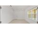 This is a well-lit room with tile flooring and a bright window at 10556 Sw 96Th Lane Rd, Ocala, FL 34481