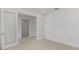 The airy room is illuminated by light filtering through interior glass panel doors and the neutral tile floor at 10556 Sw 96Th Lane Rd, Ocala, FL 34481