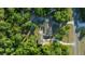 Secluded property with mature trees features home, circular drive, and additional parking at 11806 Sw 61St Place Rd, Ocala, FL 34481