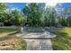 Backyard features a stone fire pit and access to a storage building at 11806 Sw 61St Place Rd, Ocala, FL 34481