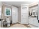 Bathroom with a toilet, and granite vanity with white cabinets, and a built-in storage unit at 11806 Sw 61St Place Rd, Ocala, FL 34481