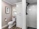 Compact bathroom with a white vanity, tile flooring and a glass enclosed shower at 11806 Sw 61St Place Rd, Ocala, FL 34481