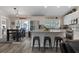Modern kitchen featuring white cabinetry, stainless steel appliances and a kitchen island with seating at 11806 Sw 61St Place Rd, Ocala, FL 34481