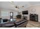 Living room showcasing neutral paint, plank flooring, and an exterior entrance at 11806 Sw 61St Place Rd, Ocala, FL 34481